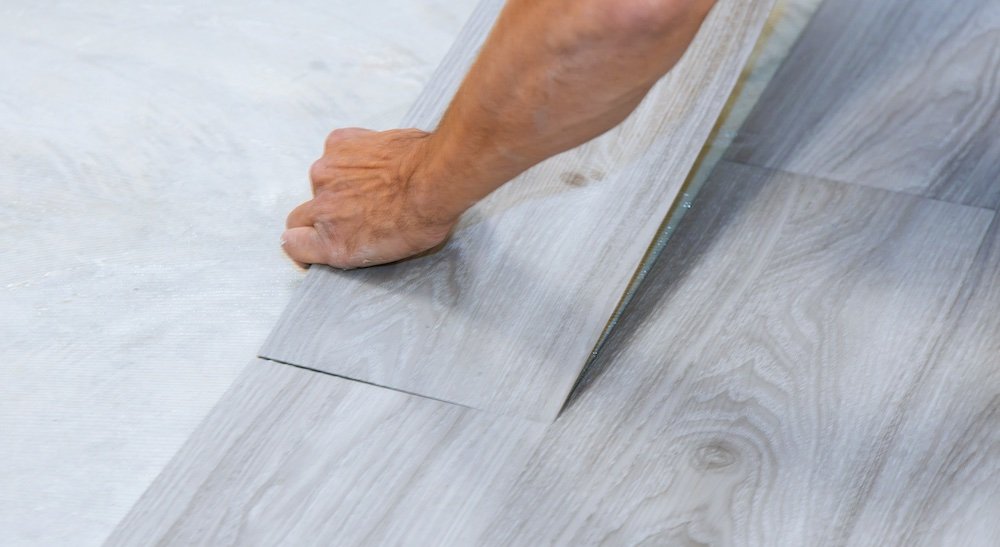 NuCore vinyl plank flooring being installed with click-lock joints